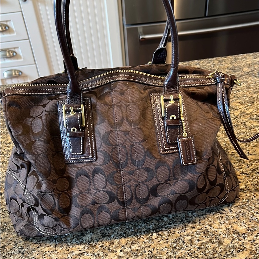 Coach Brown Shoulder Bag with Monogram Pattern and Leather Handles